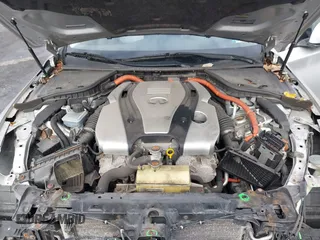 2014 Infiniti Q50 Hybrid Premium with VIN JN1AV7AR9EM700727, listed as a IAAI auction lot 41461433 with 169,882 mi miles. Bid and sale history available at carsss.com. Image 10.