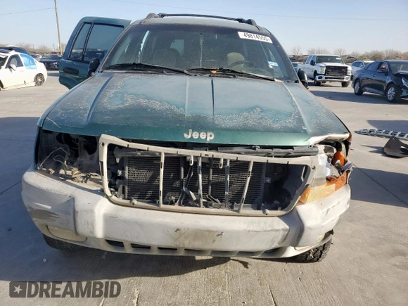 1999 Jeep Grand Cherokee Laredo with VIN 1J4G258S0XC561054, listed as a Copart auction lot 49814555 with Not provided miles and Salvage title. Bid and sale history available at DreamBid. Image 5.