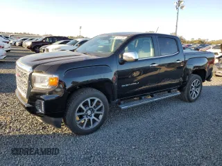 2021 GMC Canyon 2WD Denali with VIN 1GTG5EEN2M1107052, listed as a Copart auction lot 76377704 with 11,696 mi miles and Salvage Title. Bid and sale history available at carsss.com. Image 1.
