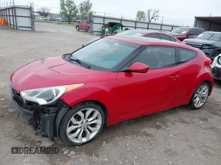 2013 Hyundai Veloster w/Gray Int z VIN KMHTC6AD8DU146035, wystawiony jako IAAI lot #41892703 z przebiegiem 241 169 mil mil oraz . Historia ofert i sprzedaży dostępna na DreamBid. Obrazek 17.