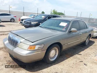 2002 Mercury Grand Marquis LS Premium z VIN 2MEFM75W22X617584, wystawiony jako IAAI lot #42444579 z przebiegiem 199 914 mil mil oraz . Historia ofert i sprzedaży dostępna na DreamBid. Obrazek 2.