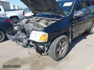 2004 GMC Envoy SLE with VIN 1GKDS13S942294303, listed as a IAAI auction lot 41992547 with 196,444 mi miles. Bid and sale history available at carsss.com. Image 6.