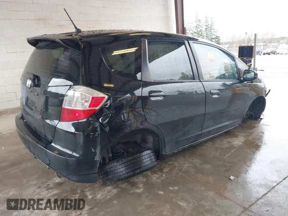 2013 Honda Fit Sport with VIN JHMGE8H57DC033384, listed as a IAAI auction lot 41871356 with 150,777 mi miles. Bid and sale history available at carsss.com. Image 4.