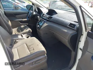 2014 Honda Odyssey EX-L with VIN 5FNRL5H69EB048867, listed as a IAAI auction lot 42190464 with 172,487 mi miles and . Bid and sale history available at carsss.com. Image 5.