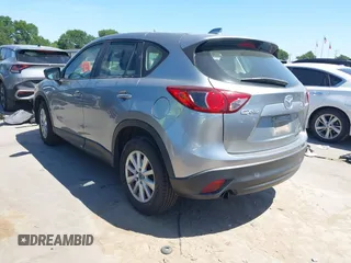 2014 Mazda CX-5 Sport with VIN JM3KE2BE7E0371203, listed as a IAAI auction lot 42243756 with 121,534 mi miles and . Bid and sale history available at DreamBid. Image 3.