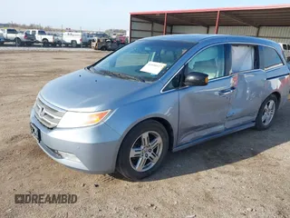 2011 Honda Odyssey Touring with VIN 5FNRL5H9XBB085626, listed as a IAAI auction lot 41890577 with 178,317 mi miles and . Bid and sale history available at DreamBid. Image 2.
