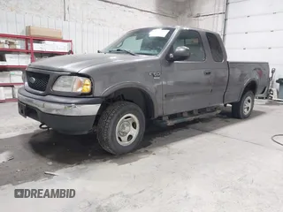 2002 Ford F-150 XL with VIN 1FTRX18W92KA81797, listed as a IAAI auction lot 42250147 with 162,918 mi miles and . Bid and sale history available at DreamBid. Image 2.