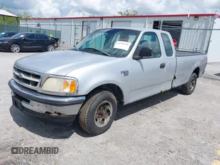 1998 Ford F-150 with VIN 1FTZX1767WNB79135, listed as a IAAI auction lot 42251761 with 221,839 mi miles and . Bid and sale history available at DreamBid. Image 2.