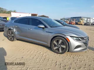 2021 Volkswagen Arteon SE z VIN WVWAR7AN2ME012169, wystawiony jako IAAI lot #42220242 z przebiegiem 39 097 mil mil oraz . Historia ofert i sprzedaży dostępna na DreamBid. Obrazek 1.