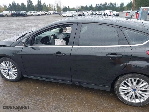 2015 Ford Focus Titanium with VIN 1FADP3N2XFL300859, listed as a IAAI auction lot 41944410 with 76,194 mi miles. Bid and sale history available at carsss.com. Image 15.