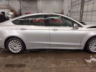 2016 Ford Fusion SE Hybrid z VIN 3FA6P0LU1GR304166, wystawiony jako IAAI lot #41932720 z przebiegiem 68 058 mil mil oraz . Historia ofert i sprzedaży dostępna na DreamBid. Obrazek 14.