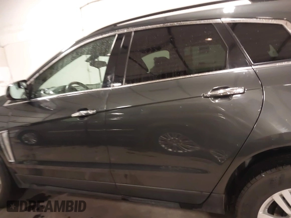 2014 Cadillac SRX with VIN 3GYFNAE34ES665630, listed as a IAAI auction lot 41315281 with 99,009 mi miles and . Bid and sale history available at DreamBid. Image 14.