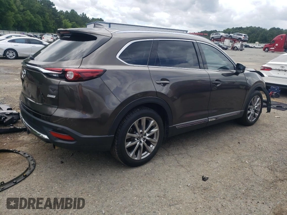 2018 Mazda CX-9 Grand Touring с VIN JM3TCADY9J0205299, выставлен на аукционе Copart как лот 60306095 с пробегом 113 766 миль миль и Списание • Salvage title. История ставок и продаж доступна на DreamBid. Изображение 3.