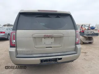 2015 GMC Yukon XL SLE z VIN 1GKS1GKC1FR155056, wystawiony jako IAAI lot #41517607 z przebiegiem 174 634 mil mil oraz . Historia ofert i sprzedaży dostępna na DreamBid. Obrazek 16.