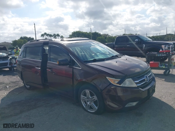 2011 Honda Odyssey Touring with VIN 5FNRL5H97BB008759, listed as a IAAI auction lot 41567010 with 215,709 mi miles. Bid and sale history available at carsss.com. Image 6.