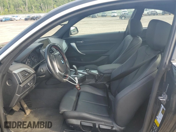 2016 BMW 2 Series 228i xDrive with VIN WBA1G9C52GV598419, listed as a Copart auction lot 62464515 with 49,793 mi miles and Salvage title. Bid and sale history available at DreamBid. Image 7.