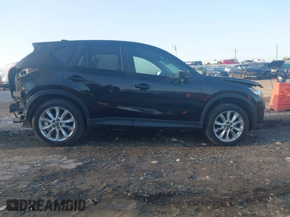 2015 Mazda CX-5 Grand Touring with VIN JM3KE4DY6F0513173, listed as a IAAI auction lot 41867030 with 93,770 mi miles. Bid and sale history available at carsss.com. Image 13.