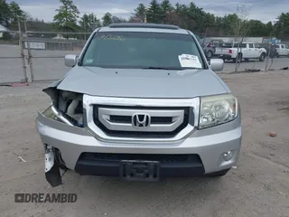 2011 Honda Pilot Touring with VIN 5FNYF4H90BB022354, listed as a IAAI auction lot 41965082 with 126,505 mi miles and . Bid and sale history available at carsss.com. Image 13.