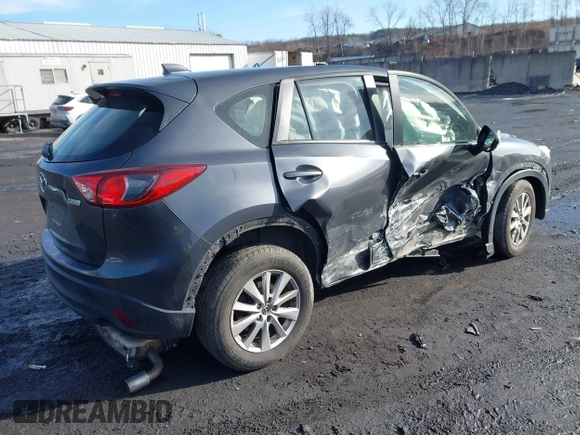 2015 Mazda CX-5 Sport with VIN JM3KE4BY1F0543507, listed as a IAAI auction lot 41530491 with 127,995 mi miles. Bid and sale history available at carsss.com. Image 4.