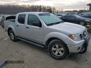 2010 Nissan Frontier SE with VIN 1N6AD0EV2AC405609, listed as a Copart auction lot 87615465 with 170,555 mi miles and Salvage title. Bid and sale history available at DreamBid. Image 4.