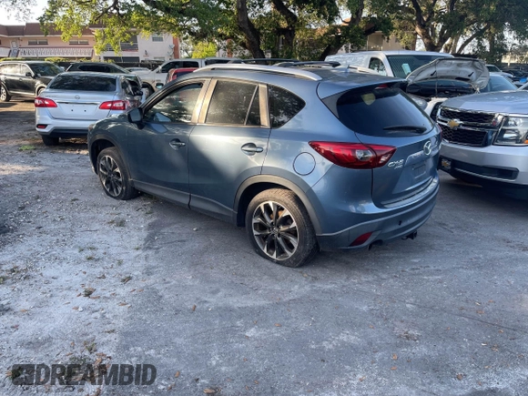 2016 Mazda CX-5 Grand Touring with VIN JM3KE4DY9G0673789, listed as a IAAI auction lot 42196841 with 98,622 mi miles and . Bid and sale history available at DreamBid. Image 3.