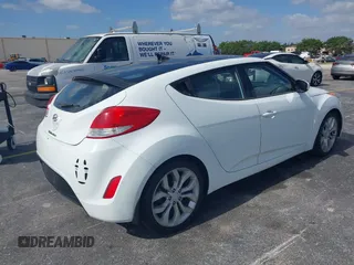 2013 Hyundai Veloster w/Gray Int with VIN KMHTC6AD0DU150516, listed as a IAAI auction lot 42164880 with 122,841 mi miles and . Bid and sale history available at DreamBid. Image 4.