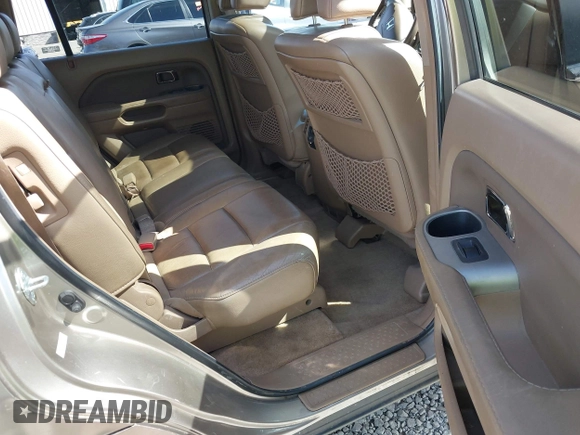 2006 Honda Pilot EX-L with VIN 2HKYF18566H561371, listed as a IAAI auction lot 41950296 with 145,579 mi miles and . Bid and sale history available at DreamBid. Image 8.