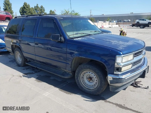 1999 Chevrolet Tahoe with VIN 1GNEC13R7XJ573387, listed as a IAAI auction lot 42001191 with 241,007 mi miles. Bid and sale history available at carsss.com. Image 1.