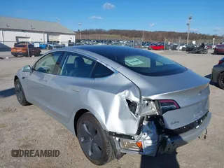 2018 Tesla Model 3 Long Range Battery with VIN 5YJ3E1EB9JF065057, listed as a IAAI auction lot 41863903 with 54,584 mi miles and . Bid and sale history available at DreamBid. Image 6.