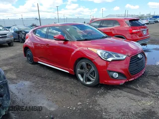 2013 Hyundai Veloster Turbo z VIN KMHTC6AE3DU126784, wystawiony jako IAAI lot #42224441 z przebiegiem 117 114 mil mil oraz . Historia ofert i sprzedaży dostępna na DreamBid. Obrazek 1.