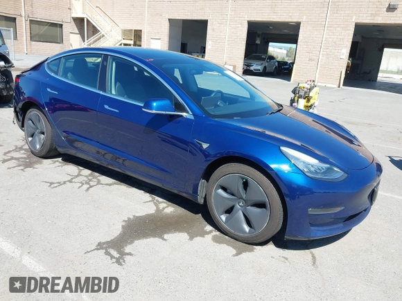 2019 Tesla Model 3 Mid Range with VIN 5YJ3E1EA0KF425079, listed as a IAAI auction lot 41871022 with 61,684 mi miles and . Bid and sale history available at DreamBid. Image 1.