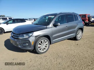 2014 Volkswagen Tiguan SEL z VIN WVGAV3AX0EW555873, wystawiony jako Copart lot #55695955 z przebiegiem 69 984 mil mil oraz Szkoda całkowita • Salvage title. Historia ofert i sprzedaży dostępna na DreamBid. Obrazek 1.