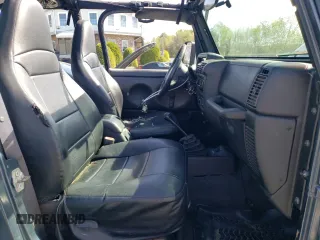 2002 Jeep Wrangler Sport with VIN 1J4FA49S92P715480, listed as a Copart auction lot 55157545 with 153,560 mi miles and Clean Title. Bid and sale history available at carsss.com. Image 8.