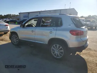 2014 Volkswagen Tiguan SE with VIN WVGAV3AX9EW611860, listed as a Copart auction lot 74431754 with 116,022 mi miles and Salvage title. Bid and sale history available at DreamBid. Image 2.