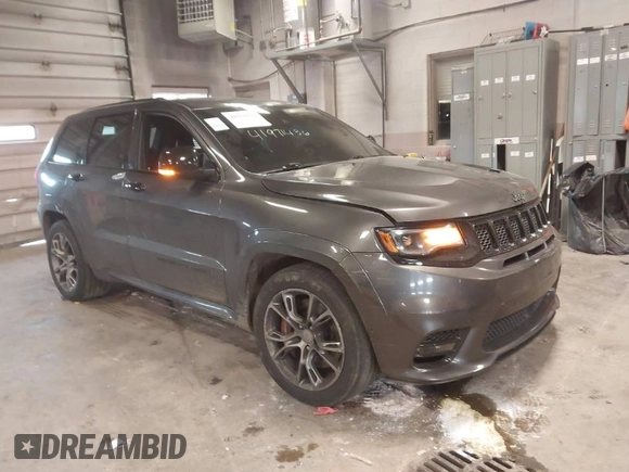 2018 Jeep Grand Cherokee SRT z VIN 1C4RJFDJ6JC432683, wystawiony jako IAAI lot #41971436 z przebiegiem 113 078 mil mil oraz . Historia ofert i sprzedaży dostępna na DreamBid. Obrazek 1.