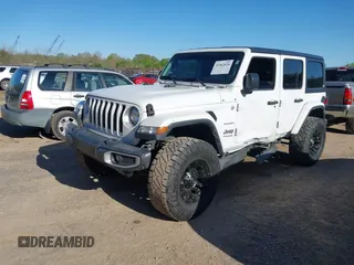 2019 Jeep Wrangler Unlimited Sahara with VIN 1C4HJXEN2KW591557, listed as a IAAI auction lot 41962034 with 88,691 mi miles and . Bid and sale history available at DreamBid. Image 17.