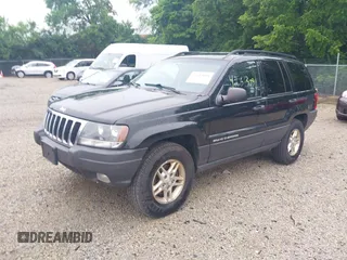 2003 Jeep Grand Cherokee Laredo with VIN 1J4GW48NX3C532874, listed as a IAAI auction lot 42613091 with 165,920 mi miles and . Bid and sale history available at DreamBid. Image 2.