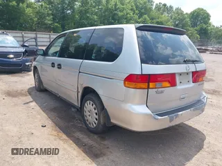 2004 Honda Odyssey LX with VIN 5FNRL18504B129349, listed as a IAAI auction lot 42393492 with 243,232 mi miles and . Bid and sale history available at DreamBid. Image 3.