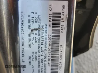 2012 Mazda 3 i Touring with VIN JM1BL1V85C1644077, listed as a Copart auction lot 56778845 with 166,714 mi miles and Salvage title. Bid and sale history available at DreamBid. Image 12.
