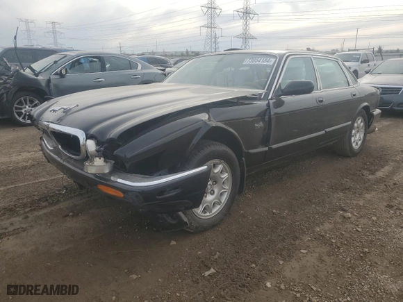 2000 Jaguar XJ with VIN SAJDA14C7YLF11390, listed as a Copart auction lot 73054184 with 0 mi miles and Salvage Title. Bid and sale history available at carsss.com. Image 1.