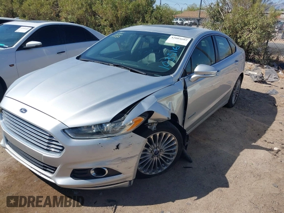 2014 Ford Fusion Titanium Hybrid with VIN 3FA6P0RUXER103516, listed as a IAAI auction lot 42004602 with 128,287 mi miles and . Bid and sale history available at carsss.com. Image 17.