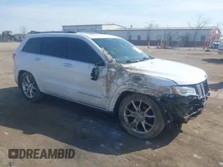 2015 Jeep Grand Cherokee Summit with VIN 1C4RJFJGXFC734025, listed as a IAAI auction lot 41842927 with 137,993 mi miles. Bid and sale history available at carsss.com. Image 1.