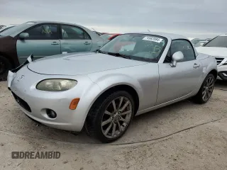 2007 Mazda MX-5 Miata Grand Touring with VIN JM1NC26FX70121911, listed as a Copart auction lot 74982084 with 167,798 mi miles and Salvage title. Bid and sale history available at DreamBid. Image 1.