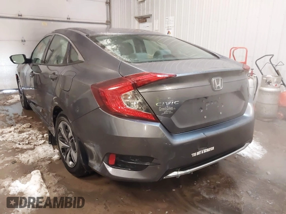 2020 Honda Civic LX z VIN 19XFC2F65LE030888, wystawiony jako IAAI lot #41609630 z przebiegiem 115 614 mil mil oraz . Historia ofert i sprzedaży dostępna na DreamBid. Obrazek 3.