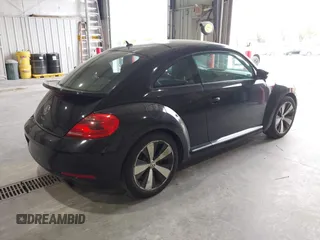 2012 Volkswagen Beetle 2.0T Turbo w/Sun/Snd/Nav PZEV with VIN 3VWVA7AT8CM617830, listed as a IAAI auction lot 42024546 with 91,688 mi miles. Bid and sale history available at carsss.com. Image 4.
