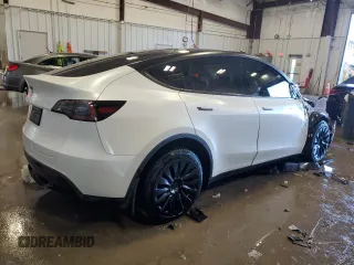 2023 Tesla Model Y Long Range z VIN 7SAYGAEE5PF672546, wystawiony jako Copart lot #42779065 z przebiegiem 27 570 mil mil oraz Nie do naprawy • Non repairable. Historia ofert i sprzedaży dostępna na DreamBid. Obrazek 3.