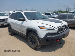 2015 Jeep Cherokee Trailhawk with VIN 1C4PJMBS5FW574102, listed as a IAAI auction lot 42278805 with 164,250 mi miles and . Bid and sale history available at DreamBid. Image 1.