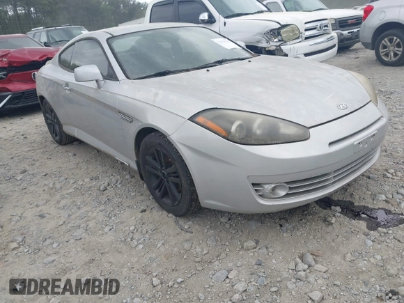 2008 Hyundai Tiburon GS z VIN KMHHM66D68U264666, wystawiony jako IAAI lot #41970123 z przebiegiem 186 448 mil mil oraz . Historia ofert i sprzedaży dostępna na DreamBid. Obrazek 1.