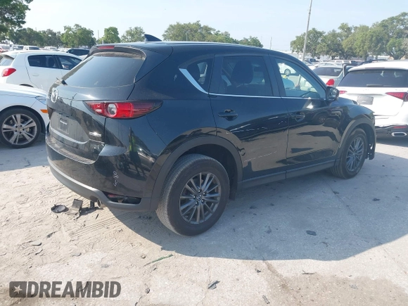 2020 Mazda CX-5 Touring with VIN JM3KFACM2L0770241, listed as a IAAI auction lot 42186952 with 41,590 mi miles and . Bid and sale history available at DreamBid. Image 4.
