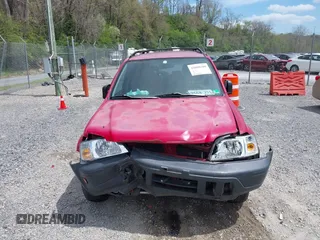 2000 Honda CR-V LX with VIN JHLRD184XYC010847, listed as a IAAI auction lot 42080100 with 256,678 mi miles and . Bid and sale history available at carsss.com. Image 12.